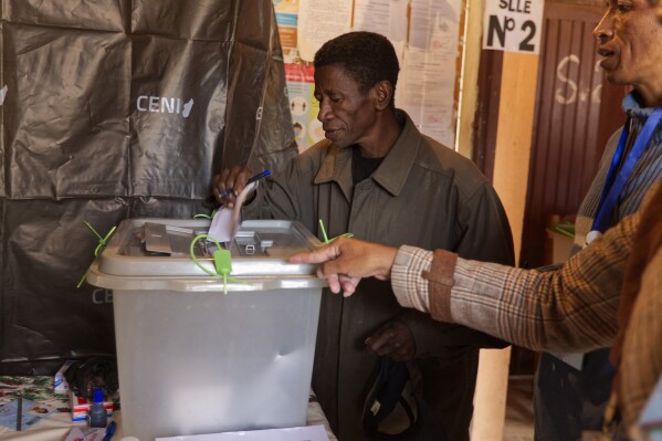 A man casts his vote in the presidential election in Antananarivo, Madagascar Thursday, Nov. 16, 2023. Madagascar's President Andry Rajoelina is pushing ahead with a presidential election Thursday, that could give him a third term, even as opposition protests roil the country and the majority of candidates have announced a boycott. (AP Photo/Alexander Joe)