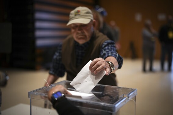 An early voter casts his ballot for Catalonia's regional elections in La Roca del Vallès, north of Barcelona, Sunday May 12, 2024. About 6 million Catalans are casting ballots in a regional election that will test if Catalonia wants pro-independence leader Carles Puigdemont back or if the wealthy region has moved on to more pressing worries. (AP Photo/Emilio Morenatti)