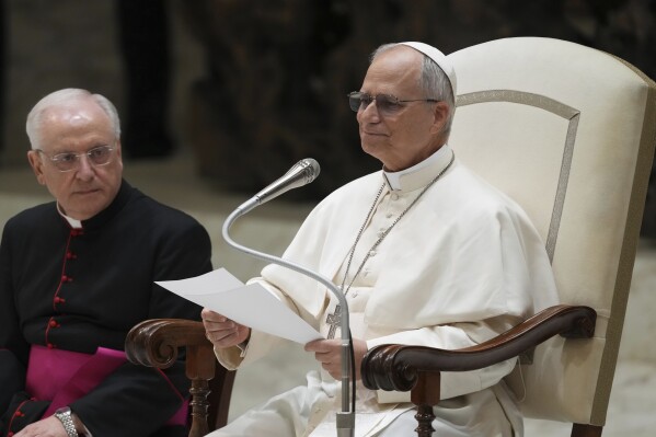Pope Leo XIV meets with members of the international media in the Paul VI Hall at the Vatican, Monday, May 12, 2025. (AP Photo/Domenico Stinellis)