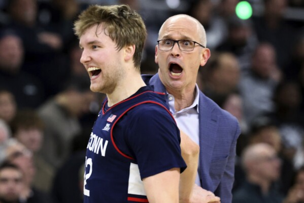 UConn coach Dan Hurley reacts after guard Cam Spencer (12) scored 3 points during the first half of the team's NCAA college basketball game against Providence, Saturday, March 9, 2024, in Providence, R.I. (AP Photo/Mark Stockwell)