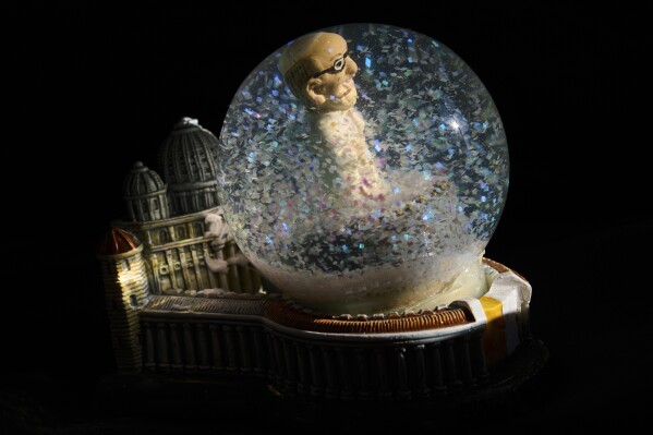 A Pope Francis snowball souvenir in Rome, Thursday, May 1, 2025. (AP Photo/Bernat Armangue)