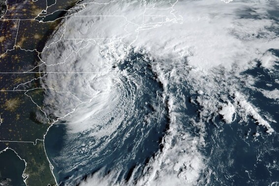 This Saturday, Sept. 23, 2023, 8:16 am EST satellite image provided by the National Oceanic and Atmospheric Administration shows Tropical Storm Ophelia making landfall in North Carolina. (NOAA via AP)