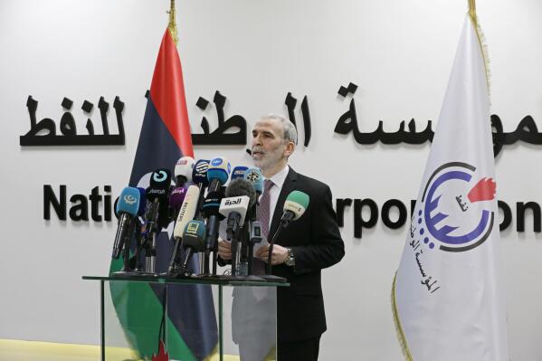 FILE - Chairman of the Libyan National Oil Corporation Mustafa Sanallah holds gives a press conference  at the corporation's headquarters in Tripoli, Libya, July 11, 2022. Libya's National Oil Corporation said it resumed oil exports, ending a monthslong hiatus. It said a Malta-flagged tanker, Matala, docked Wednesday, July 20, 2022, at the al-Sidra terminal to ship one million barrels of crude oil. The resumption of oil export has come after one of the country’s rival governments fired Sanallah the chairman of the state-run oil corporation (AP Photo/Yousef Murad, File)