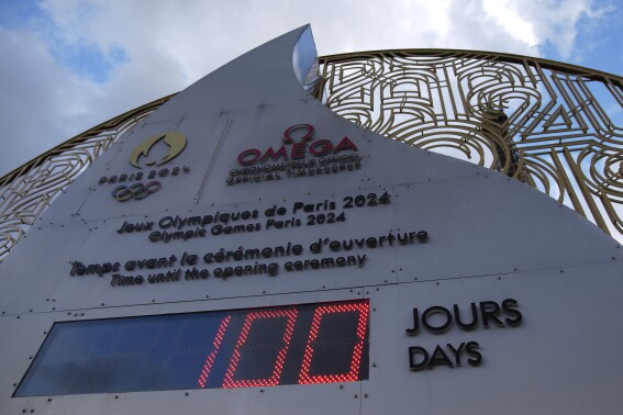 The countdown clock reads 100 days before the Paris 2024 Olympic Games opening ceremony,Tuesday, April 16, 2024 in Paris. The Paris 2024 Olympic Games will run from July 26 to Aug. 11(AP Photo/Christophe Ena)