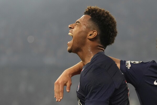 PSG's Desire Doue celebrates after scoring his side's second goal against Inter Milan during the Champions League final soccer match at the Allianz Arena in Munich, Germany, May 31, 2025. (AP Photo/Matthias Schrader)