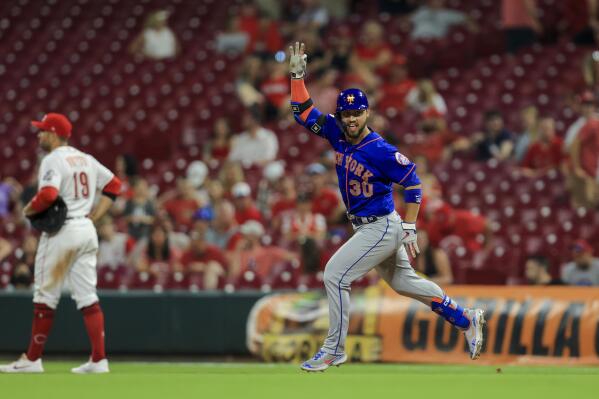 New York Mets' Michael Conforto gestures after hitting a solo home run during the 11th inning of a baseball game against the Cincinnati Reds in Cincinnati, Monday, July 19, 2021. The Mets won 15-11. (AP Photo/Aaron Doster)