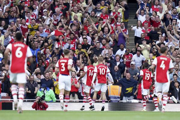 Arsenal's Pierre-Emerick Aubameyang, center, celebrates scoring their side's first goal of the game during their English Premier League soccer match at The Emirates Stadium, London, Saturday, Sept. 11, 2021. (Tess Derry/PA via AP)