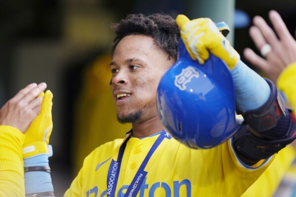 Boston Red Sox's Ceddanne Rafaela celebrates after his two-run home run during the seventh inning of a baseball game against the Chicago Cubs, Saturday, April 27, 2024, in Boston. (AP Photo/Michael Dwyer)