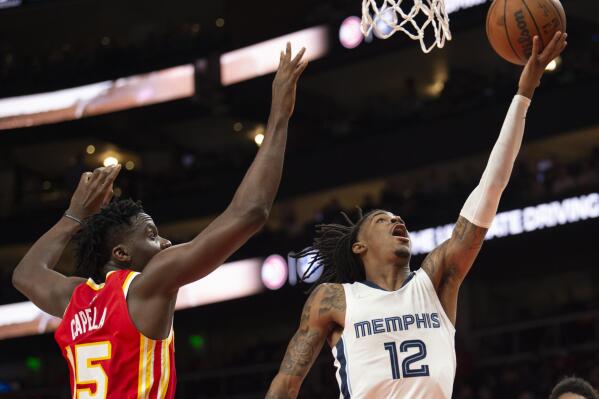 Memphis Grizzlies guard Jarrett Culver (23) shoots over Atlanta Hawks  center Clint Capela (15) during the