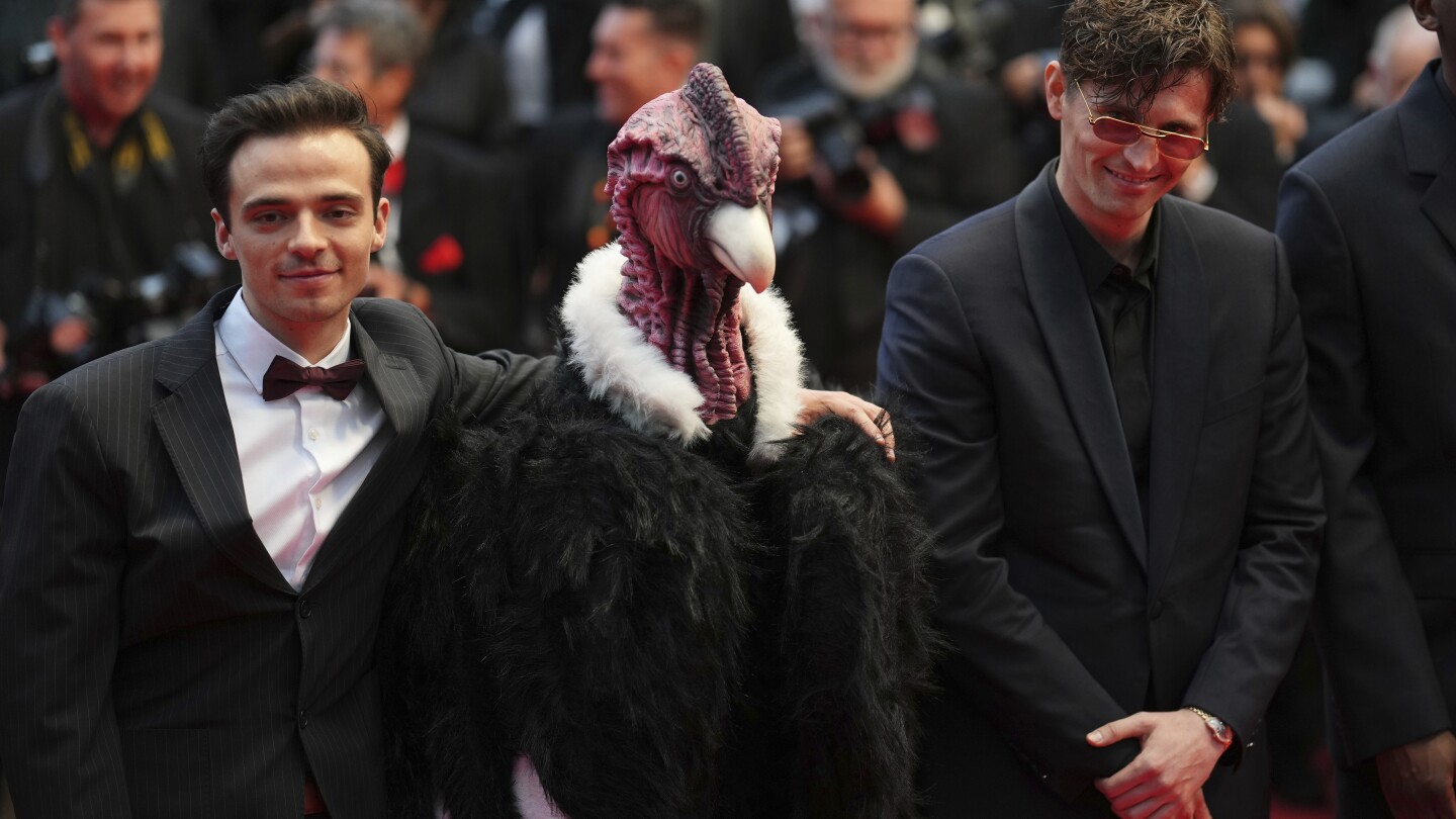 Bird man on red carpet leaves Cannes squawking