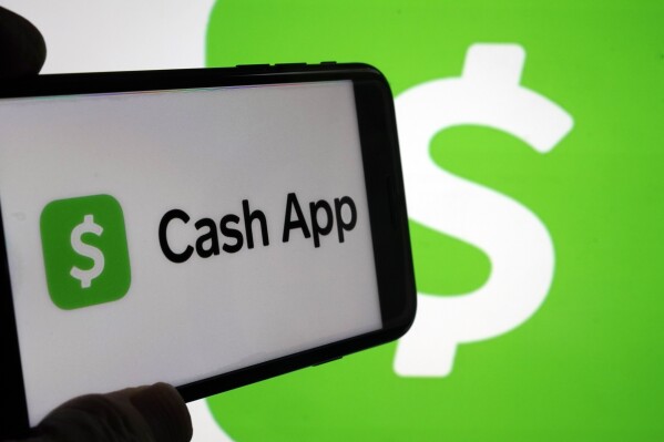 FILE - Cash App logos are seen on a phone screen, Sept. 8, 2023, in New York. (AP Photo/Richard Drew, File)