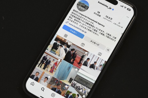 The instagram page of Japan's Imperial Household Agency is seen on a mobile phone Monday, April 1, 2024, in Tokyo. Japan’s Imperial Family made an Instagram debut on Monday, with images of Emperor Naruhito and Empress Masako capturing moments of their official duties, an effort to shake off their cloistered image and reach out to the younger generations.(Ǻ Photo/Eugene Hoshiko)