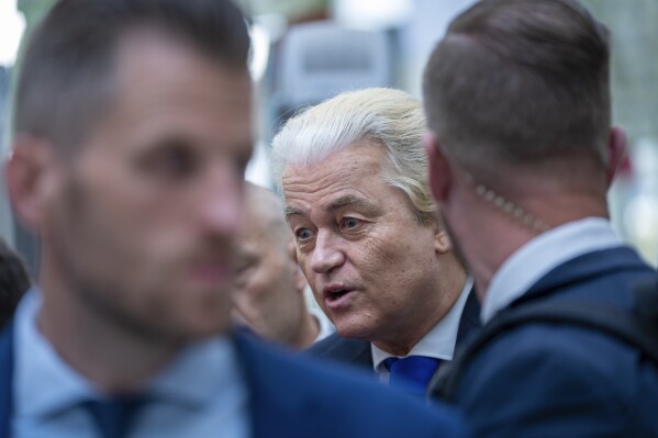 FILE - Anti-Islam lawmaker Geert Wilders of the PVV, or Party for Freedom, is interviewed after casting his ballot for the European election in The Hague, Netherlands, Thursday June 6, 2024. The four parties negotiating to form a coalition government in the Netherlands have reached agreement on a new team of Cabinet ministers, far-right leader Geert Wilders said Tuesday, June 11, 2024. It's another key step toward forming the first Dutch government led by a far-right party Wilders, whose Party for Freedom won national elections more than six months ago, did not immediately give details. (AP Photo/Peter Dejong, File)