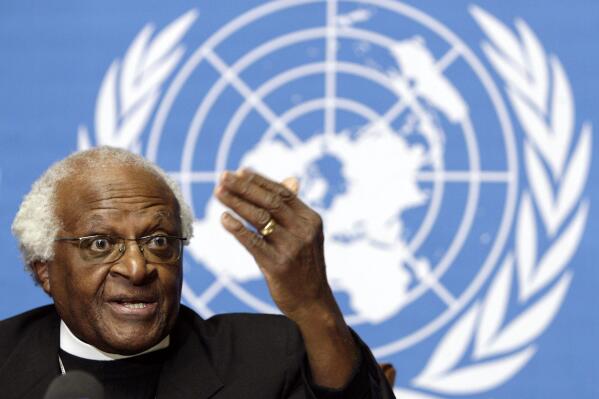 South Africa's Desmond Tutu, Archbishop and Nobel Peace Prize laureate, reacts about Israel blocked Tutu's UN mission to Beit Hanun, during a press conference at the United Nations in Geneva, Switzerland, Monday, Dec. 11, 2006.  South Africa’s Nobel Peace Prize-winning activist for racial justice and LGBT rights and retired Anglican Archbishop of Cape Town, has died, South African President Cyril Ramaphosa announced Sunday, Dec. 26, 2021. He was 90. (Salvatore Di Nolfi/Keystone via AP)
