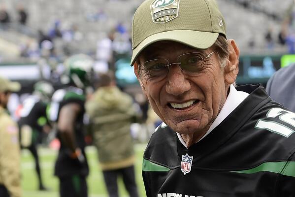FILE - Former New York Jets quarterback Joe Namath walks the field as the Jets warm up before an NFL football game against the New York Giants in East Rutherford, N.J., in this Sunday, Nov. 10, 2019, file photo. The franchise has been on a mostly fruitless search since Namath last played for the Jets in 1976, an often frustrating span during which 34 players have started at quarterback for New York. Zach Wilson, the No. 2 overall pick in April, will likely become No. 35 when the Jets kick off the regular season at Carolina on Sept. 12. (AP Photo/Steven Ryan, File)