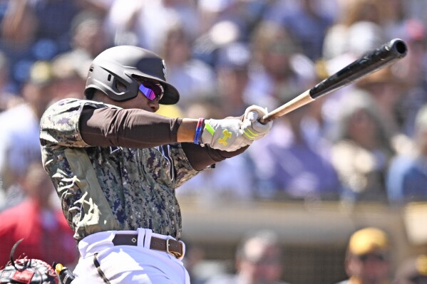 San Diego Padres' Juan Soto hits a three-run home run during the first inning of a baseball game against the St. Louis Cardinals, Sunday, Sept. 24, 2023, in San Diego. (AP Photo/Denis Poroy)