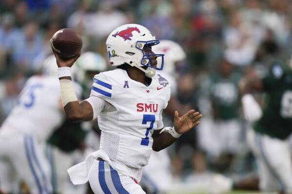 SMU quarterback Kevin Jennings (7) passes during the first half of the American Athletic Conference Championship NCAA college football game against Tulane, Saturday, Dec. 2, 2023 in New Orleans. (AP Photo/Gerald Herbert)