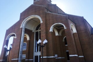FILE - This Sunday, Feb. 26, 2017 file photo shows the sanctuary at Briarwood Presbyterian Church, in Birmingham, Ala. Alabama Gov. Kay Ivey has signed legislation permitting Briarwood Presbyterian Church to establish its own police force for its church and school campuses. (AP Photo/Anthony Izaguirre, File)