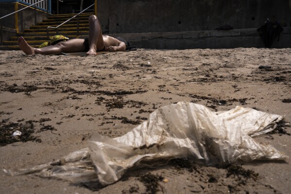 Plastic waste lays on a beach in Hong Kong, Saturday, April 13, 2024. Hong Kong has long been a major producer and consumer of great food, and a great amount of plastic and Styrofoam to go with it. That’s going to change as new legislation aiming to stop the sale and distribution of Styrofoam products and single-use plastic cutlery went into effect on Monday, April 22, 2024.(AP Photo/Louise Delmotte)