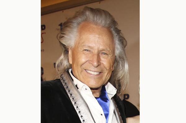 FILE - Peter Nygard attends the 24th Night of 100 Stars Oscars Viewing Gala on March 2, 2014, in Beverly Hills, Calif. Lawyers for Peter Nygard on Wednesday, April 26, 2023, asked the Manitoba Court of Appeal to reconsider a United States extradition order, citing concerns over the Canadian fashion mogul's health if he were to serve time in the U.S.(Photo by Annie I. Bang /Invision/AP, File)