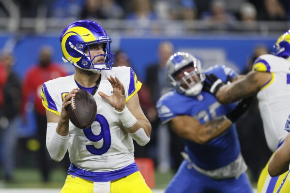 Los Angeles Rams quarterback Matthew Stafford throws during the first half of an NFL wild-card playoff football game against the Detroit Lions, Sunday, Jan. 14, 2024, in Detroit. (AP Photo/Duane Burleson)