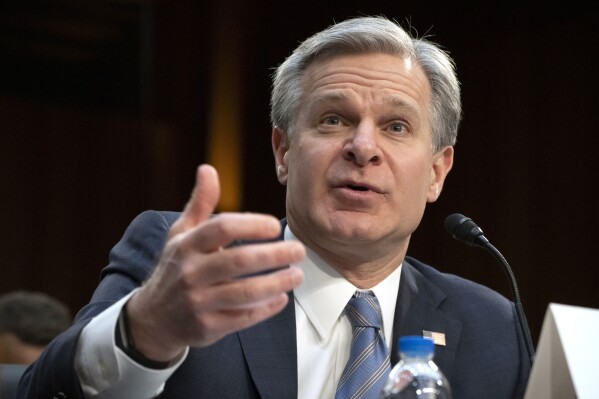 FILE - FBI Director Christopher Wray speaks during a hearing of the Senate Intelligence Committee on Capitol Hill, March 11, 2024, in Washington. Wray is set to testify about the bureau’s investigation into the attempted assassination of former President Donald Trump, with lawmakers at a congressional hearing likely to press him for fresh details about the gunman’s motive and background.(ĢӰԺ Photo/Mark Schiefelbein, File)