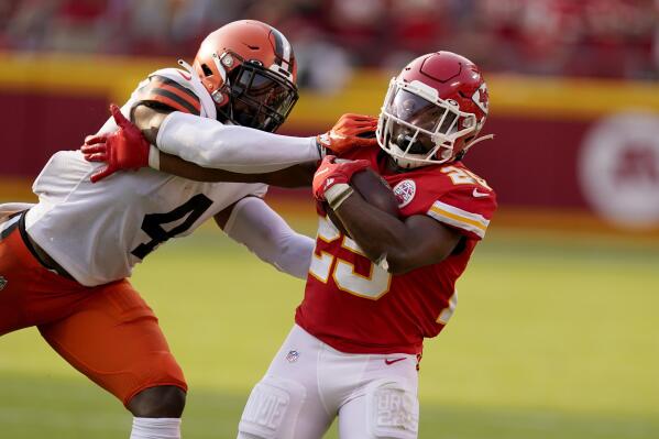 Kansas City Chiefs running back Clyde Edwards-Helaire, right, runs with the ball as Cleveland Browns linebacker Anthony Walker Jr. (4) defends during the second half of an NFL football game Sunday, Sept. 12, 2021, in Kansas City, Mo. (AP Photo/Charlie Riedel)