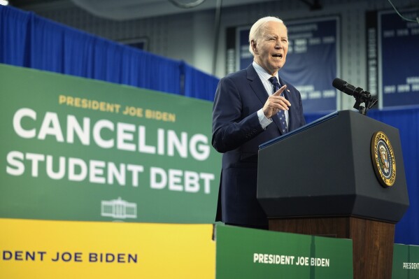 FILE - President Joe Biden speaks about student loan debt at Madison College, April 8, 2024, in Madison, Wis. Relatively few Americans say they're fans of Biden's work on the issue of student loans, according to a new poll from the University of Chicago Harris School of Public Policy and The Associated Press-NORC Center for Public Affairs Research conducted May 16-21. The survey found that three in 10 U.S. adults say they approve of how Biden has handled the issue of student loan debt, while 4 in 10 disapprove. (AP Photo/Evan Vucci, File)