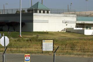 FILE - The Federal Correctional Institution is shown in Dublin, Calif., July 20, 2006. A federal correctional officer at a women’s prison in California was charged Friday, Dec. 3, 2021, with sexually abusing an inmate, just months after the prison’s warden was arrested for similar conduct. The officer, John Russell Bellhouse, worked at FCI Dublin. (AP Photo/Ben Margot, File)