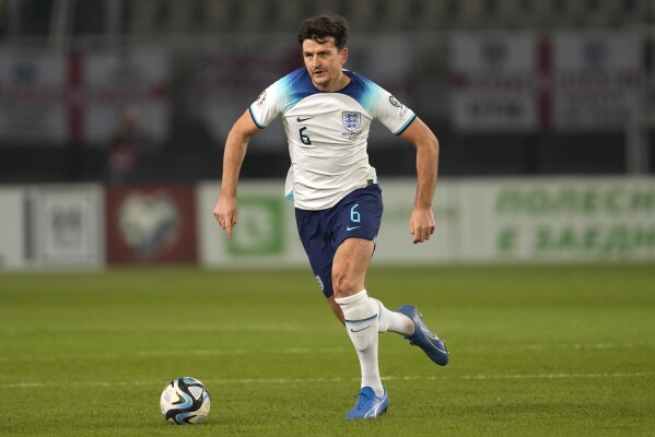 FILE - England's Harry Maguire runs with the ball during the Euro 2024 group C qualifying soccer match between North Macedonia and England at National Arena Todor Proeski in Skopje, North Macedonia, Monday, Nov. 20, 2023. England defender Harry Maguire will miss the European Championship after confirming on Thursday, June 6, 2024, that he has been cut from Gareth Southgate's squad. (AP Photo/Darko Vojinovic, File)