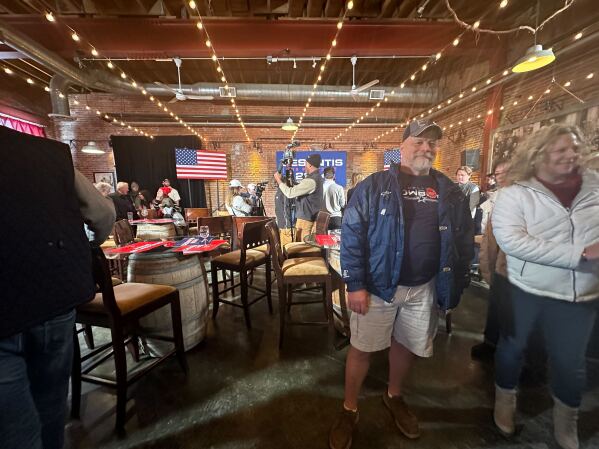 Despite the subzero temperatures, Iowa voter Mark Calhoun wore shorts to see Republican candidate Ron DeSantis speak in Dubuque, Iowa on Sunday. (AP Photo/Hannah Fingerhut)