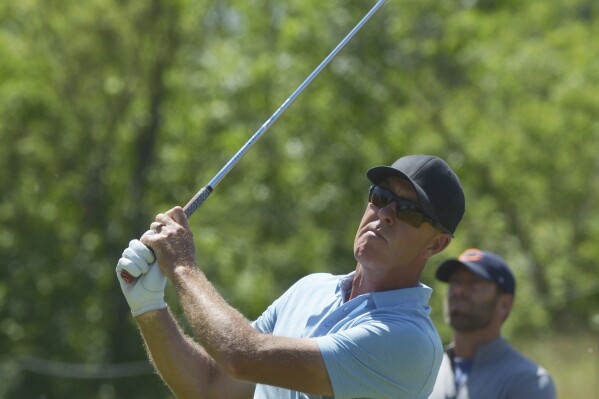 Richard Green tees off on the 17th hole during the first round of Senior PGA Championship golf tournament Thursday, May 23, 2024, at Harbor Shores in Benton Harbor, Mich. (Don Campbell/The Herald-Palladium via AP)