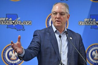 Louisiana Gov. John Bel Edwards gives an update on the spread of coronavirus in the state of Louisiana, Thursday, April 9, 2020, at GOHSEP in Baton Rouge, La. (Hilary Scheinuk/The Advocate via AP)