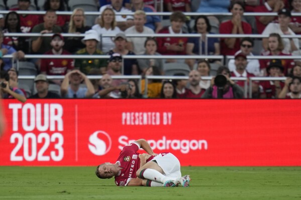 Wrexham forward Paul Mullin stays on the field after an injury during the first half of a club friendly soccer match against Manchester United, Tuesday, July 25, 2023, in San Diego. (AP Photo/Gregory Bull)