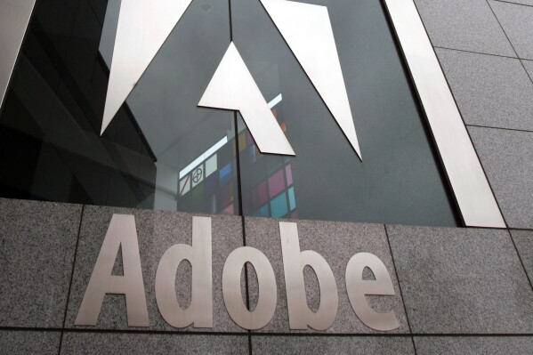 FILE - This Dec. 13, 2006 file photo shows an exterior view of the Adobe headquarters in San Jose, Calif. Adobe's $20 billion acquisition of online design company Figma is being terminated due to regulatory concerns, the companies said Monday, Dec. 16, 2023. The cash-and-stock deal, which was announced in September 2022, was initially viewed as a way to have Figma’s web-based, multi-player capabilities accelerate the delivery of Adobe’s creative cloud technologies on the web, making the creative process more productive and accessible to more people. (AP Photo/Paul Sakuma, File)