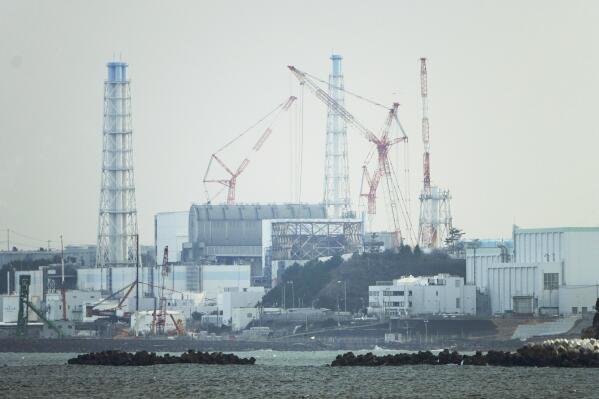 FILE - The Fukushima Daiichi nuclear power plant sits in coastal towns of both Okuma and Futaba, as seen from the Ukedo fishing port in Namie town, northeastern Japan, Wednesday, March 2, 2022. The head of a U.N. nuclear agency task force assessing the safety of Japan's plan to release treated radioactive water from the wreaked Fukushima nuclear plant into the sea said Friday, Jan. 20, 2023, that Japanese regulators have shown their commitment to comply with international safety standards. (AP Photo/Hiro Komae, File)