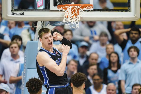 Duke center Kyle Filipowski reacts after a dunk during the second half of the team's NCAA college basketball game against North Carolina on Saturday, March 4, 2023, in Chapel Hill, N.C. (AP Photo/Jacob Kupferman)