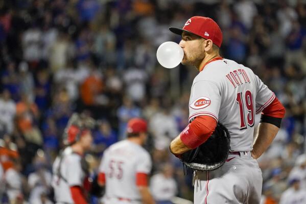 Cincinnati Reds' Joey Votto blows a gum bubble in the ninth inning of the baseball game against the New York Mets, Saturday, July 31, 2021, in New York. (AP Photo/Mary Altaffer)