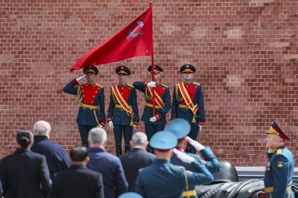 The Kremlin guards attend a wreath laying ceremony at the Tomb of the Unknown Soldier in Alexander Garden after the Victory Day military parade in Moscow, Russia, Friday, May 9, 2025, during celebrations of the 80th anniversary of the Soviet Union's victory over Nazi Germany during the World War II. (Yuri Kochetkov/Pool Photo via AP)
