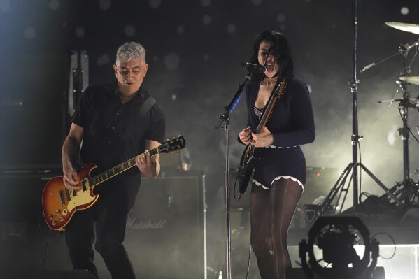 St. Vincent, right, performs with Pat Smear of Nirvana during the FireAid benefit concert on Thursday, Jan. 30, 2025, at The Forum in Inglewood, Calif. (AP Photo/Chris Pizzello)