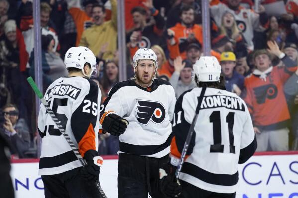 Philadelphia Flyers' Kevin Hayes, center, celebrates with James van Riemsdyk, left, and Travis Konecny after scoring a goal during the second period of an NHL hockey game against the Arizona Coyotes, Thursday, Jan. 5, 2023, in Philadelphia. (AP Photo/Matt Slocum)