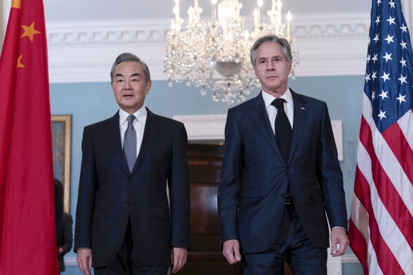 FILE - Secretary of State Antony Blinken, right, accompanied by China's Foreign Minister Wang Yi, walk to meet the media after a bilateral meeting at the State Department in Washington, Oct. 26, 2023. Blinken will travel to China, the State Department announced Saturday, April 20, 2024, as the rivals attempt to keep ties on an even keel despite severe differences over issues ranging from the path to peace in the Middle East to the supply of synthetic opioids that have heightened fears over global stability. (AP Photo/Jose Luis Magana, File)