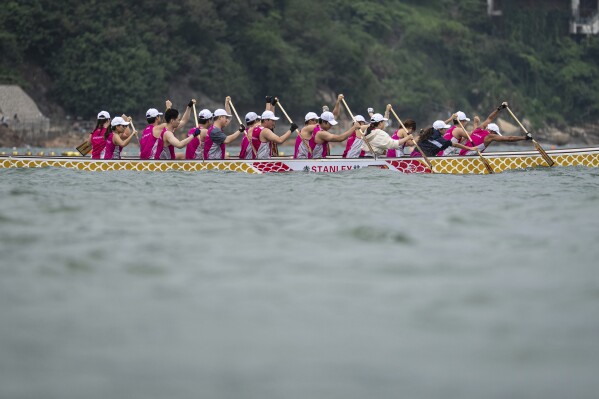 Competitors take part in the Stanley International Dragon Boat Championships to celebrate the Dragon Boat Festival in Hong Kong, Saturday, May 31, 2025. (AP Photo/Chan Long Hei)