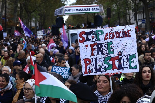 Protesters march during a demonstration to support the Palestinian people in Gaza, Saturday, Nov. 4, 2023 in Paris. (AP Photo/Aurelien Morissard)