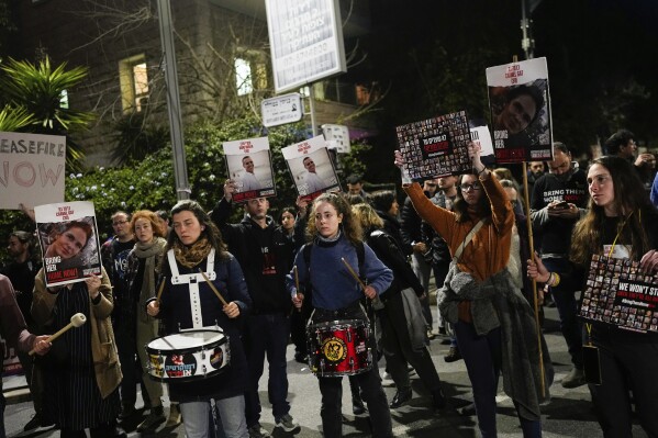 Relatives and supporters of the Israeli hostages held in the Gaza Strip by the Hamas militant group attend a protest calling for their release outside Israeli Prime Minister Benjamin Netanyahu's residence, in Jerusalem, Sunday, Jan. 21, 2024. (AP Photo/Ohad Zwigenberg)