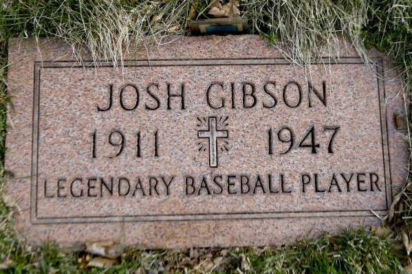 The grave stone for baseball player Josh Gibson is shown at Allegheny Cemetery in Pittsburgh on March 17, 2017. Gibson became Major League Baseball’s career batting leader with a .372 average, surpassing Ty Cobb’s .367 when records of the Negro Leagues for more than 2,300 players were incorporated Tuesday, May 28, 2024, after a three-year research project. (AP Photo/Keith Srakocic, File)