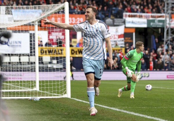 Nottingham Forest's Chris Wood celebrates scoring his side's first goal of the game, during the English Premier League soccer match between Luton Town and Nottingham Forest, at Kenilworth Road, in Luton, England, Saturday March 16, 2024. (Kieran Cleeves/PA via AP)