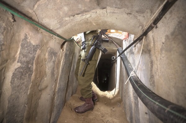 UPDATES INSTRUCTIONS - An Israeli soldier stands in an underground tunnel found underneath Shifa Hospital in Gaza City, Wednesday, Nov. 22, 2023. Israel says that Hamas militants sought cover on the grounds of the hospital and used the tunnel for military purposes. (AP Photo/Victor R. Caivano)