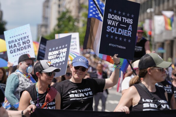 Participants from the Modern Military Association of America attend the World Pride Parade, Saturday, June 7, 2025, in Washington. (AP Photo/Mark Schiefelbein)