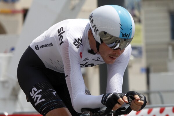 FILE - Britain's Luke Rowe competes in the twentieth stage of the Tour de France cycling race, an individual time trial over 22.5 kilometers (14 miles) with start and finish in Marseille, southern France, on July 22, 2017. British cyclist Luke Rowe, who played a role in five Tour de France victories for three different leaders, will retire at the end of the season. The 34-years-old Rowe, a good classic rider, has been riding with the team which was then known as Sky since 2012. He took part in eight consecutive editions of the Tour de France. (AP Photo/Claude Paris, File)